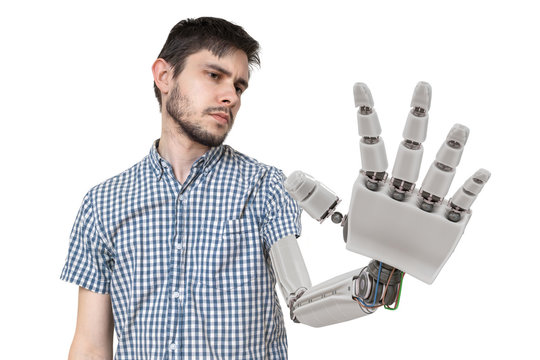 Young is looking at his robotic hand. Isolated on white background. 3D rendered illustration of hand.