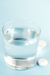 Pills and a glass of water