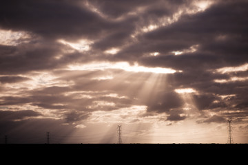 Fototapeta premium Sun Rays Shining Through Clouds Landscape