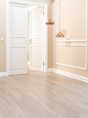 modern orange wall and decorative lamps with white door