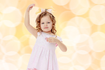 Girl shows the doll.