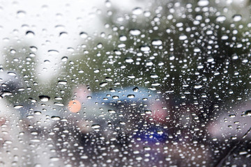 Rain drop on car glass close up background.