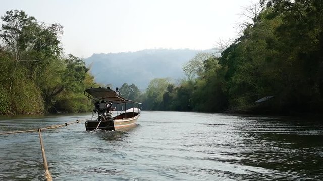 Wide angle footage of boating and rafting trip along River Kwai in Kanchanaburi, Thailand. 4K movie