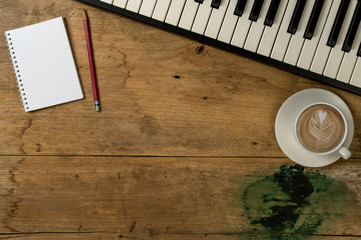 Piano keyboard on old wood desk