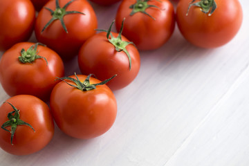 select focus - red tomatoes background. Group of tomatoes