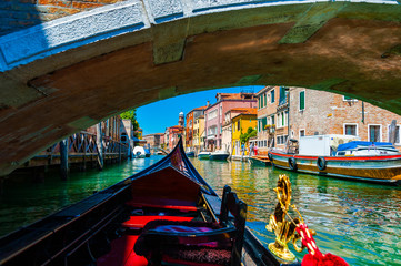 Fototapeta na wymiar View of Venetian Canal and Bridge from Gondola
