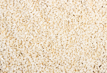 Sesame seeds as background, healthy nutrition concept