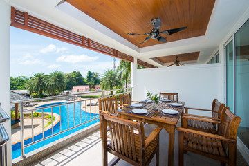 dinning table at balcony pool view in home