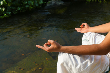 A hand showing a yoga mudra (hand gesture) known as gyan-mudra used in meditation.