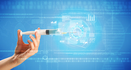 Female doctor holding syringe