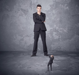 Fototapeta premium Big boss looking at tiny coworker