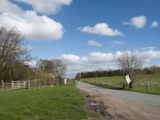 Fototapeta na wymiar Single lane road through English countryside and farmland