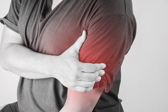 shoulder injury in humans .shoulder pain,joint pains people medical, mono tone highlight at shoulder