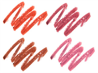 Collection of smudged lipsticks isolated on white