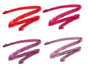 Collection of smudged lipsticks isolated on white