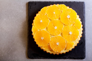 Obraz na płótnie Canvas Orange and yogurt tart, sliced,