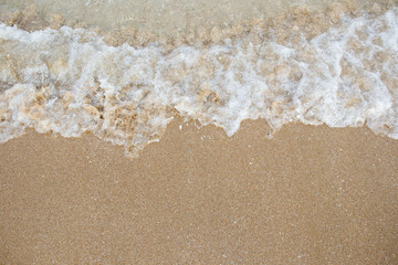 Fototapeta na wymiar Small wave at the beach background.