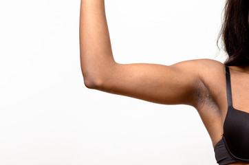 Fototapeta na wymiar Underarm view of a muscular young woman