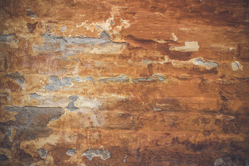 Grunge old wall with orange paint