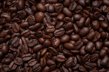 Organic coffee beans in background close up.