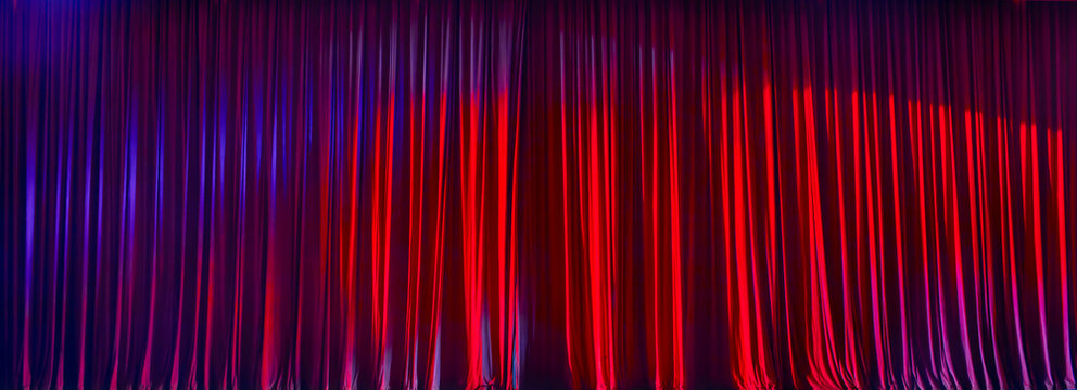 Panorama red curtains in the theater with spotlight.
