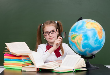 Young girl exploring the globe