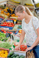 Young woman at the greengrocer's