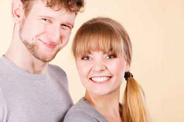 Young couple together hugging.