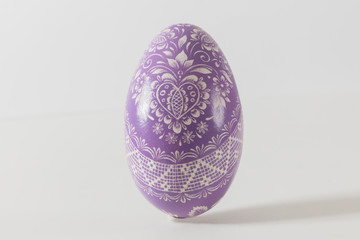 purple ornaments eastern egg on white, isolated