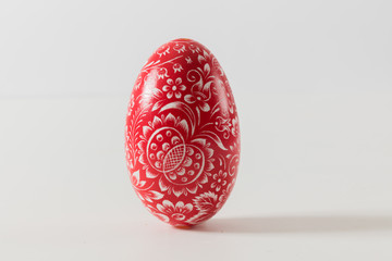 red ornaments eastern eggs on white, isolated