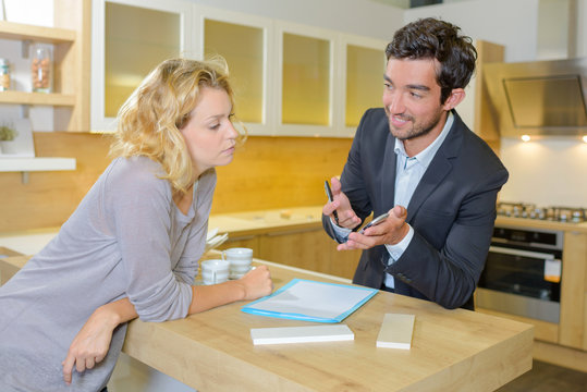 Woman in discussion with salesman