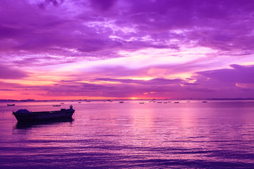 Seascape view with boats and dramatic evening sky.