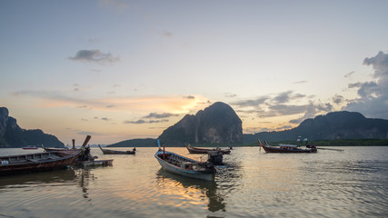 small fishing boat on the ground after ebb tide, Pakmeng bay, Thailand