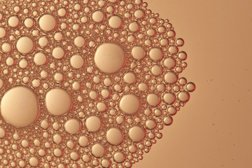 Abstract golden color liquid bubbles