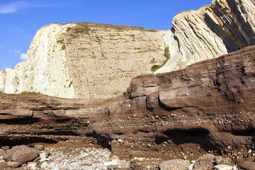 Anthropocene. Industrial sediments layer in cemented beach