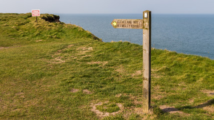 Sign: "Cleveland way", seen at Filey Brigg, North Yorkshire, UK