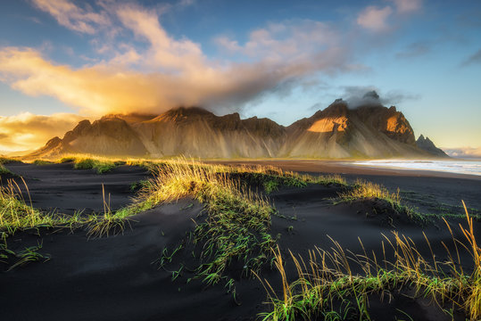 Sunset above  Vestrahorn and its black sand beach in Iceland