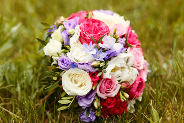 delicate bouquet of the bride on the grass