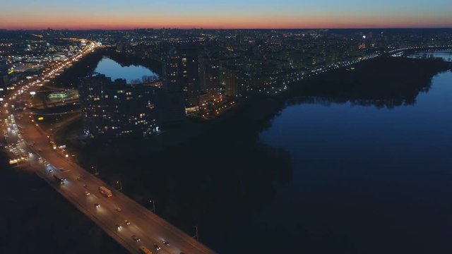 Night aerial view of Moscow Bridge over Dnieper river. Kyiv, Ukraine