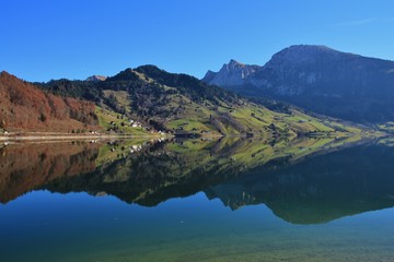 Fototapeta premium Autumn day at lake Wagital, Swiss Alps.