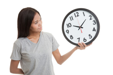 Young Asian woman with a clock.