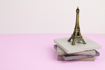 Souvenir Eiffel Tower on ceramic tiles.