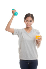 Young Asian woman with dumbbell drink orange juice.