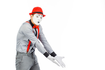 Portrait of a man, artist,clown, MIME. Shows something, isolated on white background
