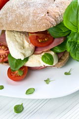 Ciabatta with ham , mozzarella, tomato and basil