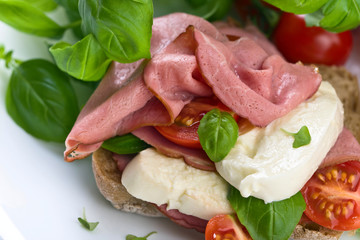 Ciabatta with ham , mozzarella, tomato and basil