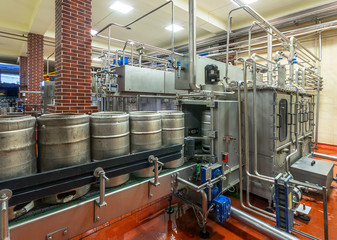 Modern beer brewery (conveyor with kegs)