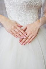 the bride's hands are crossed