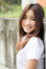 Portrait of thai adult student university uniform beautiful girl relax and smile