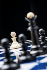 white chess pieces in the beginning of the battle